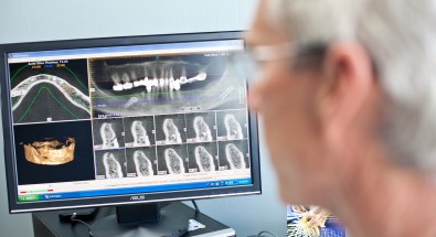 Dr. Aidelbaum examining x-rays