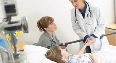 doctor checking up on young patient